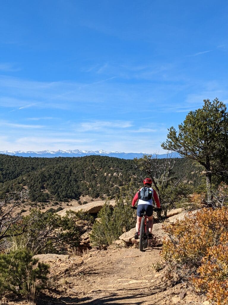 A mountain biker catches air on a trail in Fisher's Peak State Park.