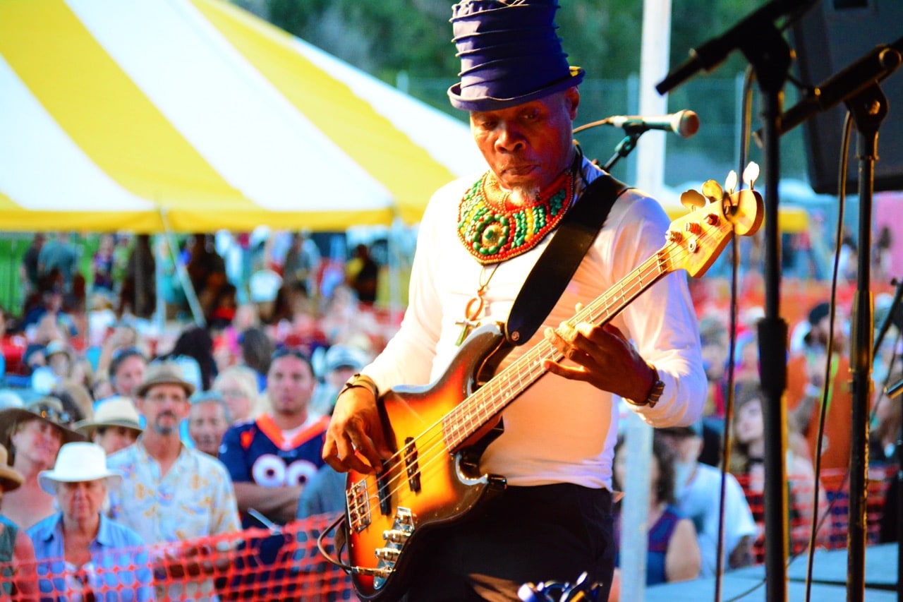 Photo of a man playing guitar on stage