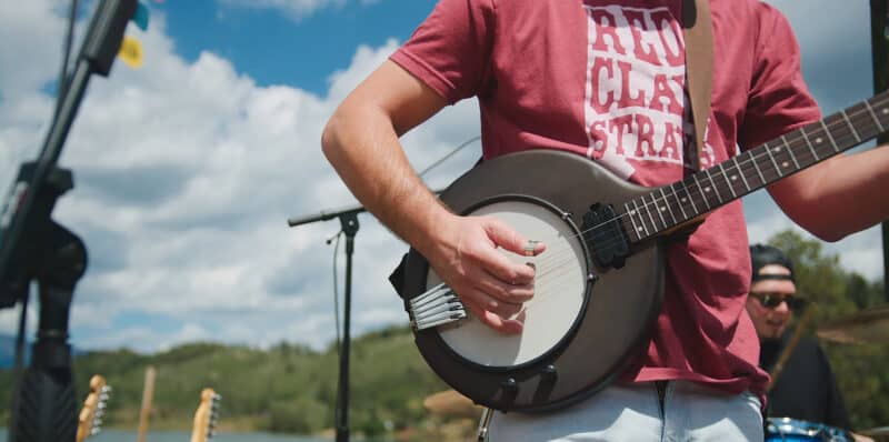 Man playing a banjo Man playing a banjo