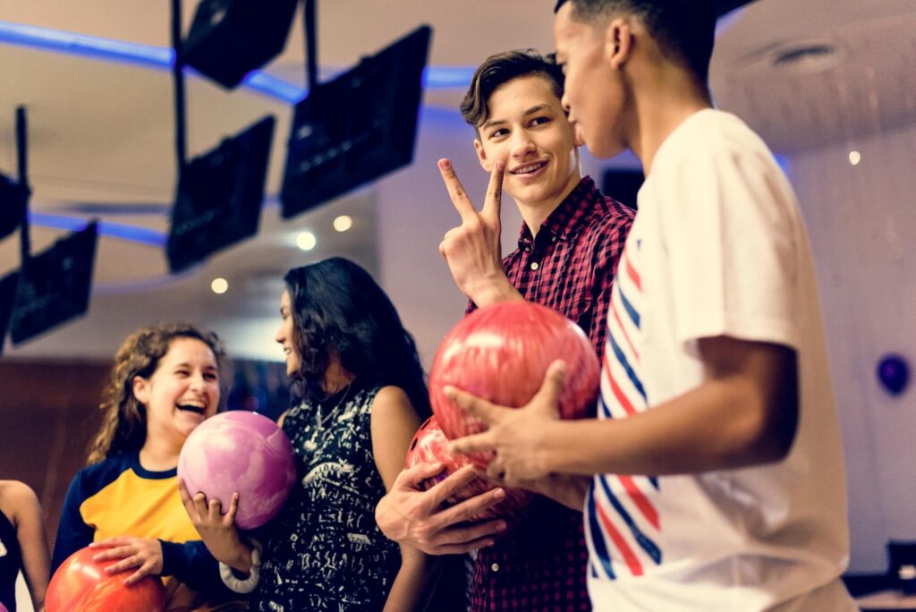 A group of kids bowling A group of kids bowling
