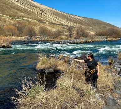 cyclist taking a break and fishing from the purgatoire river